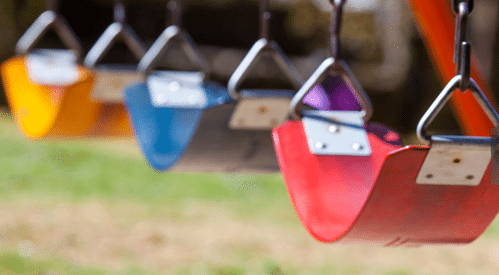 Heavy-duty commercial playground swing seats with anti-pinch chains and colorful belt seats for park installations.