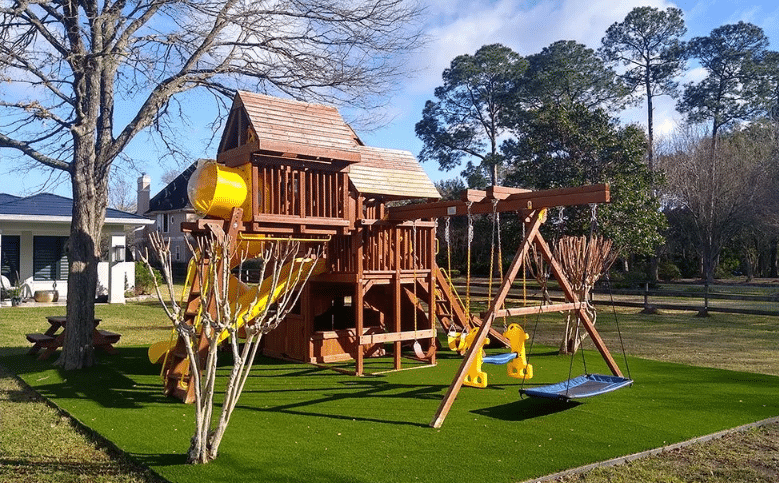 Residential artificial turf for playgrounds and premium wooden swing sets for backyards.